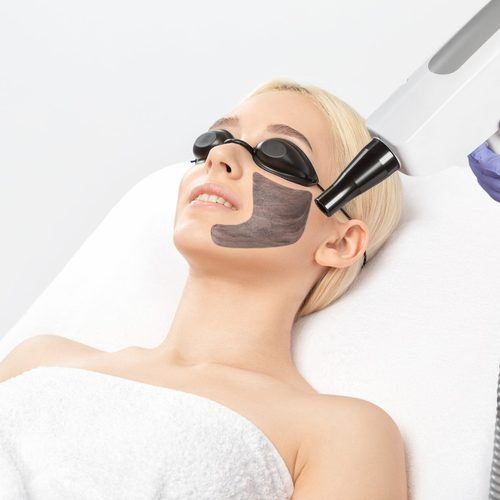 Client relaxing during a facial